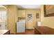 The laundry room and mud room combo is bright and spacious with access to the backyard at 4 Water Oak Cir, Ormond Beach, FL 32176