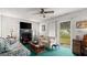 Bright living room features fireplace, sliding doors, and a desk at 4 Water Oak Cir, Ormond Beach, FL 32176