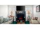 Comfortable living room with fireplace, mantle, and plush seating at 4 Water Oak Cir, Ormond Beach, FL 32176
