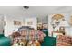 Comfortable living room showcasing traditional decor, a large sofa, and access to the dining area at 4 Water Oak Cir, Ormond Beach, FL 32176