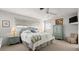 Serene main bedroom features a ceiling fan and a TV at 4 Water Oak Cir, Ormond Beach, FL 32176