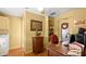 Office space features a large desk, chair, and shelves of books, all in a cozy, well-lit room at 4 Water Oak Cir, Ormond Beach, FL 32176