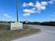 Sign for Michael Crotty Bicentennial Park on a sunny day with blue skies and wispy clouds at 4 Water Oak Cir, Ormond Beach, FL 32176