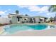 Backyard pool with a spacious patio area for outdoor dining and entertaining with mature tropical landscaping at 4 Water Oak Cir, Ormond Beach, FL 32176