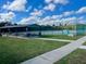 Community tennis courts with a shaded picnic area, ideal for relaxing between matches at 4 Water Oak Cir, Ormond Beach, FL 32176