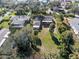 Expansive backyard with lush greenery and mature trees offers plenty of room at 445 John Anderson Dr, Ormond Beach, FL 32176