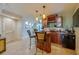 Wet bar with built in cabinets and tile flooring at 4555 S Atlantic Ave # 4508, Port Orange, FL 32127