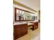 Spacious bathroom with double sinks, a large mirror, and cherry wood cabinets at 4555 S Atlantic Ave # 4508, Port Orange, FL 32127