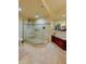 Bathroom featuring walk in shower, jacuzzi tub, neutral tile, and natural lighting at 4555 S Atlantic Ave # 4508, Port Orange, FL 32127