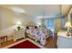 Comfortable primary bedroom featuring wood floors, natural light and a ceiling fan at 4555 S Atlantic Ave # 4508, Port Orange, FL 32127
