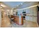 Kitchen with tile flooring, island with seating, and stainless steel appliances at 4555 S Atlantic Ave # 4508, Port Orange, FL 32127