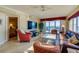 Inviting living room with gulf views, a ceiling fan, and access to a balcony at 4555 S Atlantic Ave # 4508, Port Orange, FL 32127