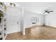 A bright living room featuring tile floors, a large window, a ceiling fan and white walls at 795 Elwood St, Deltona, FL 32725