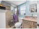 Bathroom featuring a glass enclosed shower and vessel sink at 934 Wilmington Dr, Deltona, FL 32725