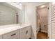 Modern bathroom featuring a sleek vanity, contemporary mirror and convenient access to shower at 1101 Deer Springs Rd, Port Orange, FL 32129