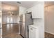 A modern kitchen featuring stainless steel appliances with living room view at 1101 Deer Springs Rd, Port Orange, FL 32129