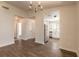 A naturally lit living room featuring modern flooring with kitchen view at 1101 Deer Springs Rd, Port Orange, FL 32129