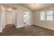 A bright living room featuring modern flooring with kitchen view at 1101 Deer Springs Rd, Port Orange, FL 32129