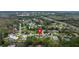 Stunning aerial view of a charming neighborhood with lush greenery, pools, and easy highway access at 13 Twin River Dr, Ormond Beach, FL 32174