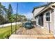 Charming back deck with outdoor seating, ideal for relaxing and enjoying the beautiful backyard view at 13 Twin River Dr, Ormond Beach, FL 32174