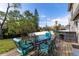 Outdoor dining set on the back deck, perfect for entertaining guests and Gathering at 13 Twin River Dr, Ormond Beach, FL 32174