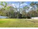 Beautiful, oversized lot with lush lawn and mature trees create a serene backyard at 13 Twin River Dr, Ormond Beach, FL 32174