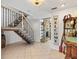 Inviting foyer with a staircase, tile flooring, and decorative furnishings at 13 Twin River Dr, Ormond Beach, FL 32174