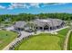 An aerial view of the golf course and country club shows the putting green and ample parking at 131 Longridge Ln, Ormond Beach, FL 32174