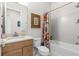 Bathroom showcasing a vanity, toilet, and a shower/tub combination with decorative shower curtain at 131 Longridge Ln, Ormond Beach, FL 32174