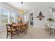 Cozy dining area featuring a wooden table and natural light at 131 Longridge Ln, Ormond Beach, FL 32174