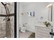 Modern bathroom featuring a tiled shower, floating shelf, and updated vanity at 134 Knight Pl, Daytona Beach, FL 32114