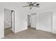 Bright bedroom featuring a ceiling fan, neutral walls, and stylish wood-look floors at 134 Knight Pl, Daytona Beach, FL 32114