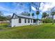 Quaint single-story home featuring a metal roof, covered porch and well maintained yard at 134 Knight Pl, Daytona Beach, FL 32114