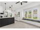 Bright and airy kitchen with white cabinets, a black island, hardwood floors, and natural light at 134 Knight Pl, Daytona Beach, FL 32114