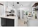 Modern kitchen with white cabinets, quartz countertops, and backsplash at 134 Knight Pl, Daytona Beach, FL 32114