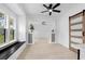 Cozy living area featuring a window seat, hardwood floors, modern lighting, and a barn door at 134 Knight Pl, Daytona Beach, FL 32114