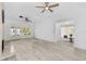 Spacious living room with modern light-colored flooring, white walls, and neutral decor at 134 Knight Pl, Daytona Beach, FL 32114