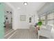 Bright sunroom with tile floors, white walls, a view of the yard, and two white chairs at 134 Knight Pl, Daytona Beach, FL 32114