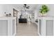 Bright open-concept living space with modern upgrades, hardwood floors, and a barn door at 134 Knight Pl, Daytona Beach, FL 32114