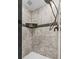 Close up of updated shower featuring modern tile and shower head at 134 Knight Pl, Daytona Beach, FL 32114