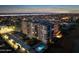 Aerial nighttime view of an apartment building with a pool at 1415 Ocean Shore Blvd # L1, Ormond Beach, FL 32176