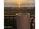 Beautiful balcony view of ocean at sunrise with a cup of coffee in hand at 1415 Ocean Shore Blvd # L1, Ormond Beach, FL 32176