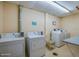 Community laundry room with washing machines and dryers at 1415 Ocean Shore Blvd # L1, Ormond Beach, FL 32176