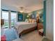 Bedroom with a king size bed, balcony, and ocean views at 1415 Ocean Shore Blvd # L1, Ormond Beach, FL 32176