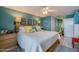 Spacious bedroom with a large bed, coastal decor, and access to the ensuite at 1415 Ocean Shore Blvd # L1, Ormond Beach, FL 32176