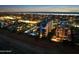 A nighttime aerial view of a beachfront condo, capturing the serene illuminated coastline at 1415 Ocean Shore Blvd # L1, Ormond Beach, FL 32176