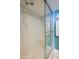 Shower room with tiled seat and glass enclosure at 1415 Ocean Shore Blvd # L1, Ormond Beach, FL 32176