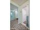 Bathroom with tiled shower and shower curtain at 1415 Ocean Shore Blvd # L1, Ormond Beach, FL 32176