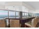 Stylish bar area with ocean views, a counter with seating, and plenty of natural light to enjoy at 3333 S Atlantic Ave # 1802, Daytona Beach, FL 32118