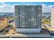 Exterior view of a beachfront high-rise condo building with a large swimming pool at 3333 S Atlantic Ave # 1802, Daytona Beach, FL 32118